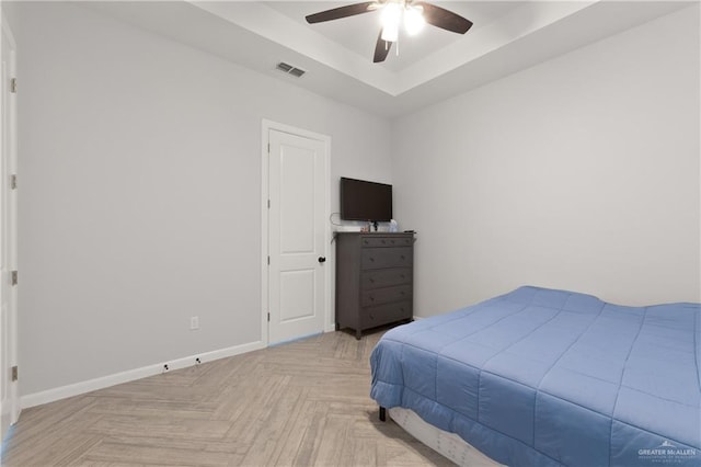 3702 Bea Ave, Harlingen, TX 78552 - bedroom with ceiling fan, baseboards, visible vents, and a raised ceiling