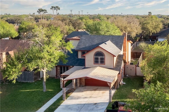 2408 River Oaks Ln, Edinburg, TX 78539 - view of front of house with concrete driveway, a chimney, and roof with shingles