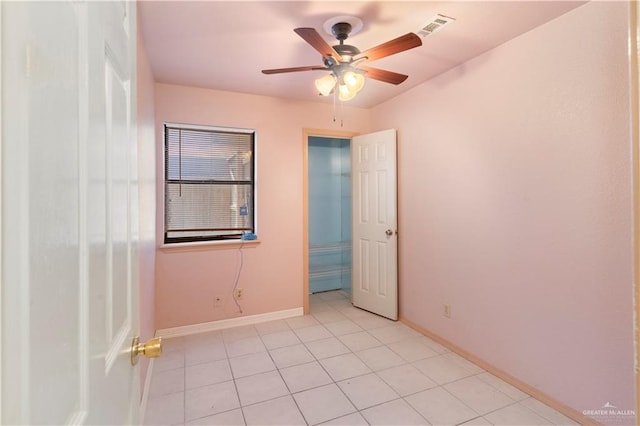 2408 River Oaks Ln, Edinburg, TX 78539 - empty room featuring light tile patterned floors, ceiling fan, and baseboards