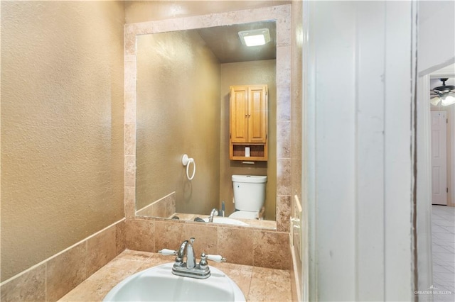 2408 River Oaks Ln, Edinburg, TX 78539 - half bathroom with toilet, a textured wall, and vanity