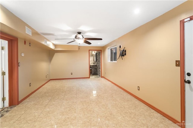 2408 River Oaks Ln, Edinburg, TX 78539 - spare room with a ceiling fan, light tile patterned floors, and baseboards
