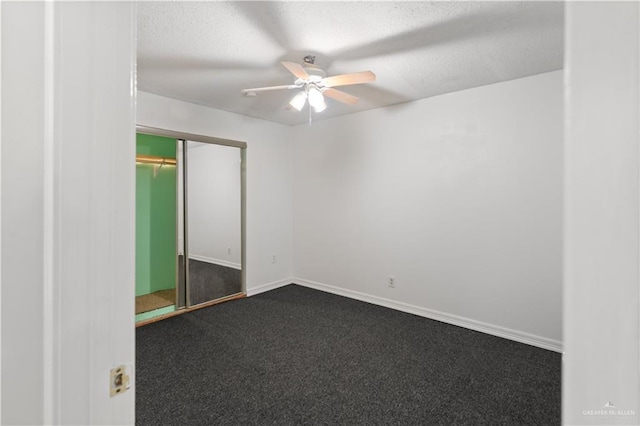 2408 River Oaks Ln, Edinburg, TX 78539 - unfurnished bedroom featuring dark colored carpet, a textured ceiling, a ceiling fan, a closet, and baseboards