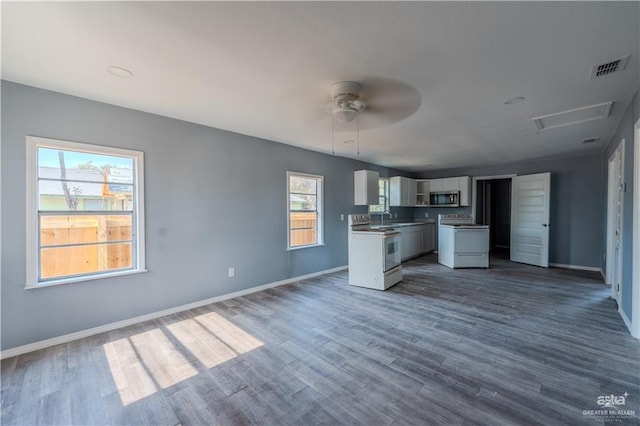 kitchen featuring white electric range, ceiling fan, white cabinets, and dark hardwood / wood-style flooring