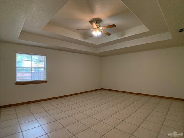 9401 N Fm 1015, Mercedes, TX 78570 - unfurnished room with a raised ceiling, a ceiling fan, and baseboards