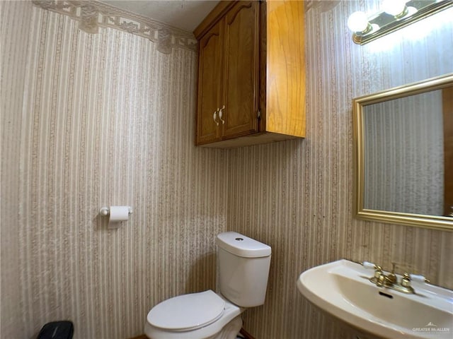 9401 N Fm 1015, Mercedes, TX 78570 - half bathroom with a sink and toilet