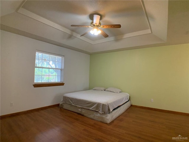 9401 N Fm 1015, Mercedes, TX 78570 - bedroom with a raised ceiling, wood finished floors, baseboards, and ceiling fan