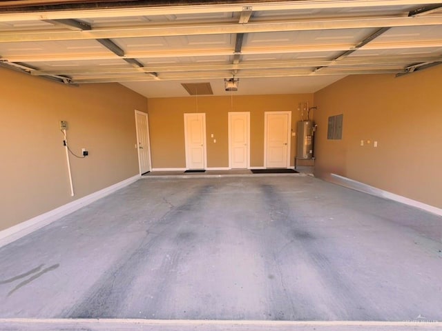 garage featuring a garage door opener, electric panel, and water heater