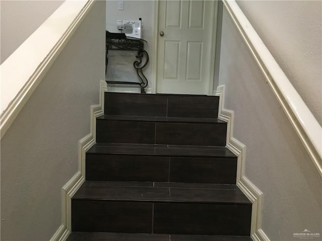 stairway with baseboards