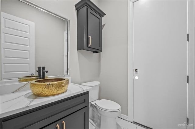 bathroom with vanity and toilet