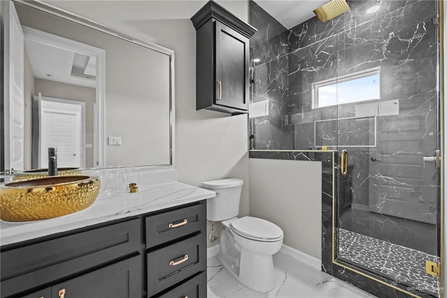 bathroom with vanity, an enclosed shower, and toilet