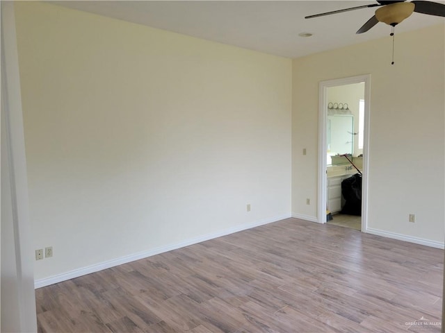 unfurnished room featuring ceiling fan and light wood-type flooring