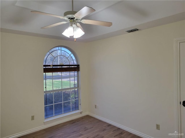 empty room featuring hardwood / wood-style flooring and ceiling fan