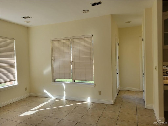 empty room with light tile patterned floors