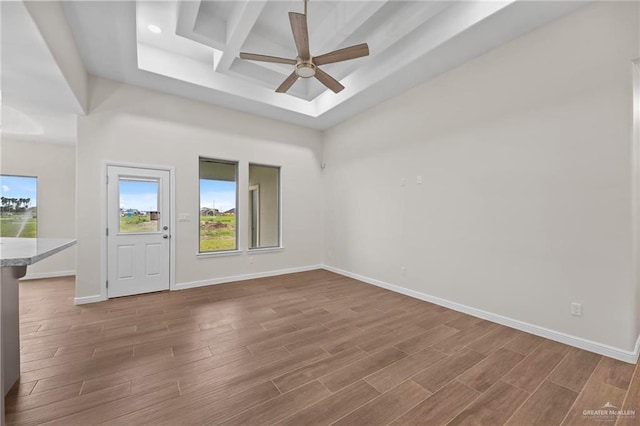 spare room featuring ceiling fan and coffered ceiling