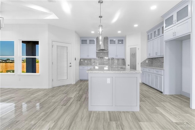3804 Crimson Ave, Mission, TX 78574 - kitchen with tasteful backsplash, a sink, wall chimney exhaust hood, and recessed lighting