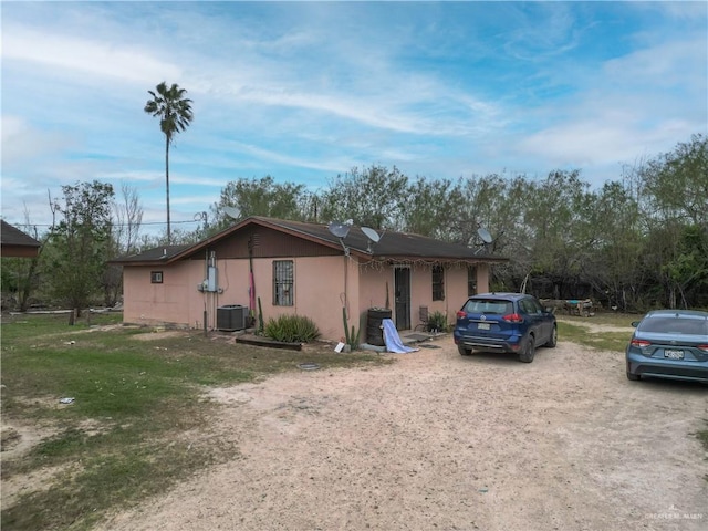 view of front of home featuring central AC unit