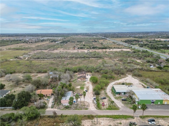 birds eye view of property featuring a rural view