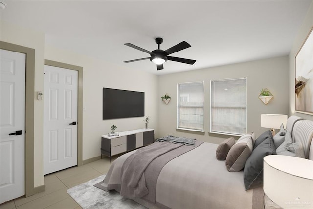 bedroom featuring ceiling fan and light tile patterned floors