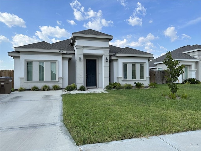 prairie-style home featuring a front yard