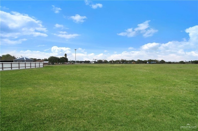 view of yard with a rural view