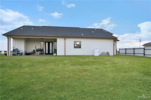 back of house featuring a yard