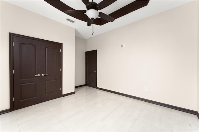 unfurnished bedroom with a closet and ceiling fan