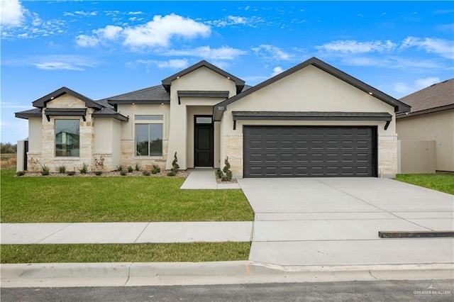 view of front of house featuring a garage, concrete driveway, stone siding, a front lawn, and stucco siding