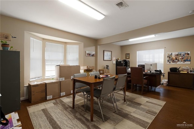 dining room featuring dark wood-type flooring