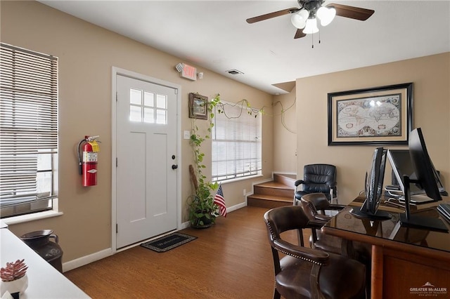 office space featuring hardwood / wood-style flooring, ceiling fan, and a wealth of natural light