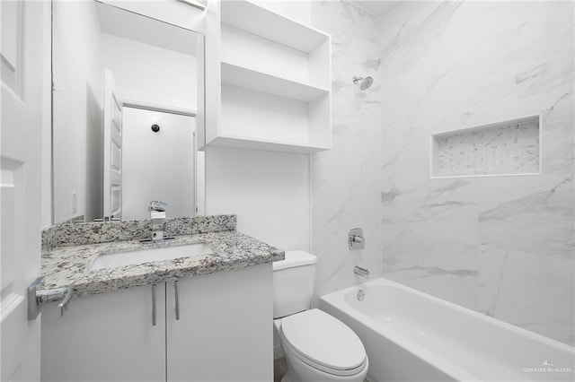 bathroom featuring toilet, vanity, and shower / tub combination