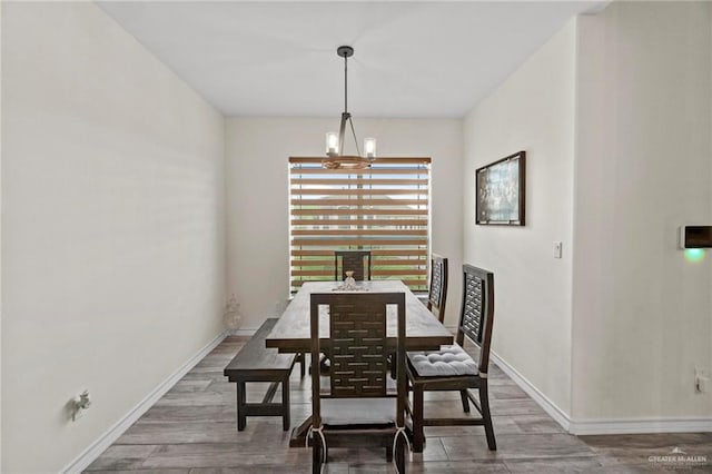 dining room featuring a chandelier and hardwood / wood-style floors