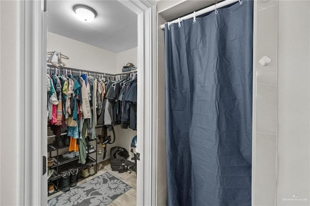 walk in closet featuring hardwood / wood-style floors