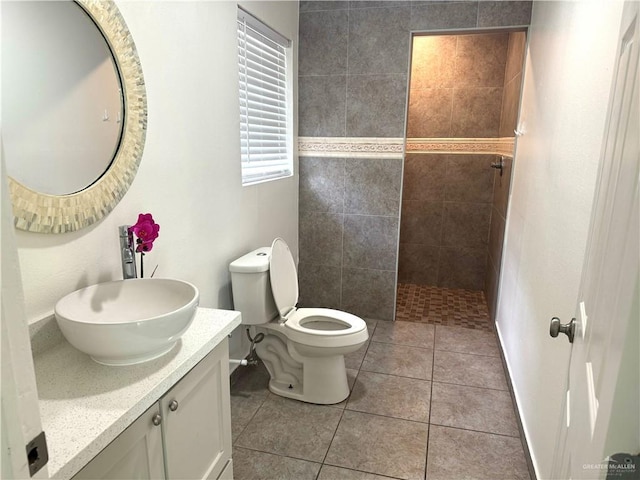 808 Tennessee Ave, Weslaco, TX 78596 - bathroom featuring walk in shower, vanity, and tile patterned floors