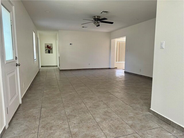 808 Tennessee Ave, Weslaco, TX 78596 - empty room featuring ceiling fan and light tile patterned floors