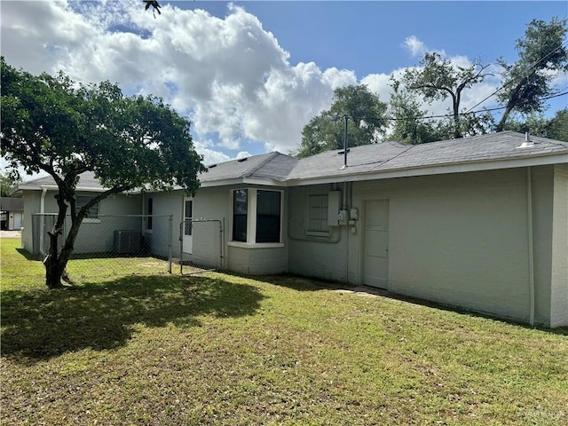 808 Tennessee Ave, Weslaco, TX 78596 - rear view of property featuring stucco siding and a gate