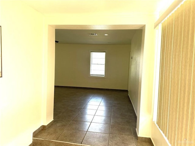 808 Tennessee Ave, Weslaco, TX 78596 - tiled spare room featuring baseboards