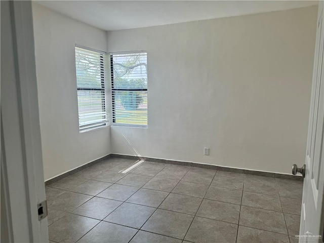 808 Tennessee Ave, Weslaco, TX 78596 - tiled spare room with healthy amount of natural light