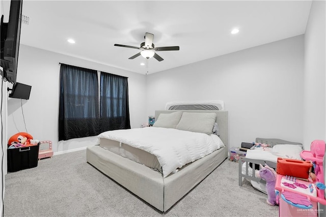 bedroom featuring ceiling fan and carpet