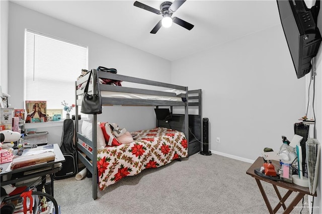 carpeted bedroom featuring ceiling fan