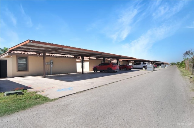 view of parking with a carport