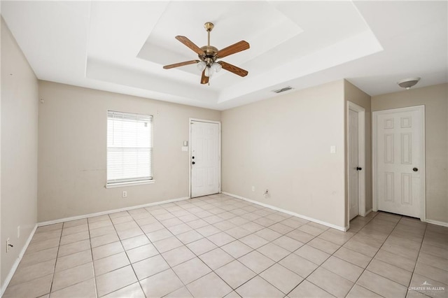 1504 Prosperity Dr, Edinburg, TX 78541 - spare room with a raised ceiling, a ceiling fan, and baseboards