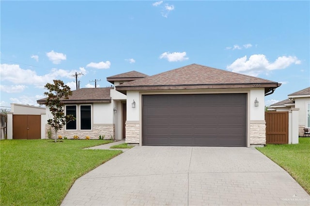 view of front of home with a front yard and a garage