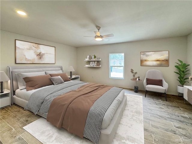 bedroom featuring ceiling fan and light hardwood / wood-style floors