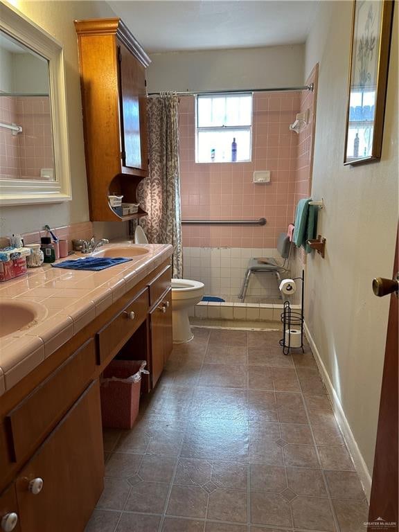 bathroom featuring a shower with curtain, tile patterned flooring, vanity, and toilet