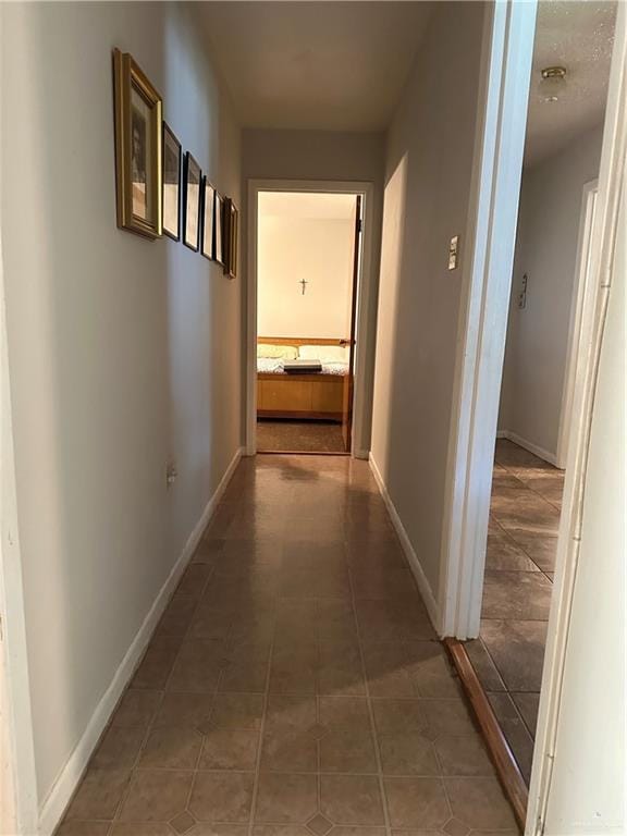 hallway featuring tile patterned floors