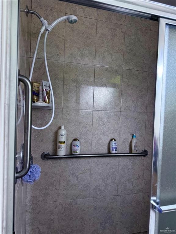 interior space featuring tiled shower
