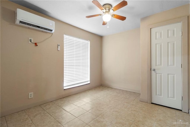 tiled empty room with ceiling fan and a wall mounted air conditioner