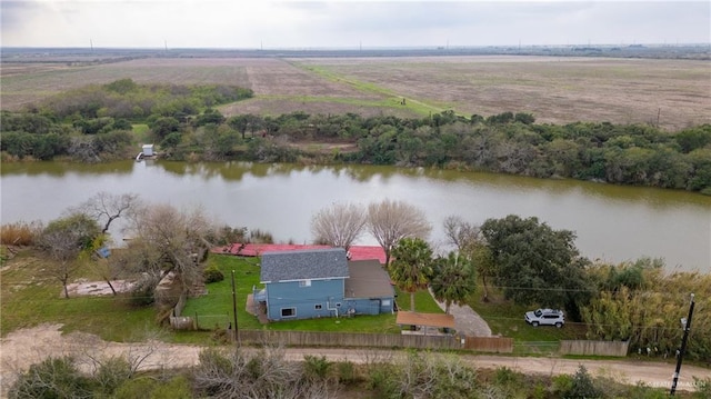 birds eye view of property featuring a water view and a rural view