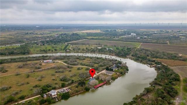 drone / aerial view featuring a rural view and a water view