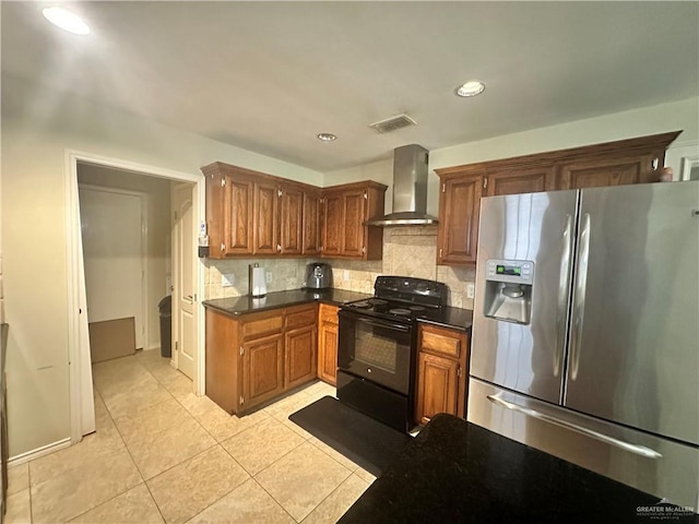 kitchen featuring light tile patterned floors, stainless steel fridge, black range with electric stovetop, tasteful backsplash, and wall chimney exhaust hood